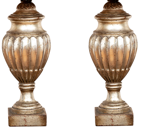 A beautiful pair of silvered table lamps shimmer in the light.